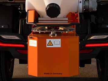 Salt spreader hooked to an Alke electric vehicle