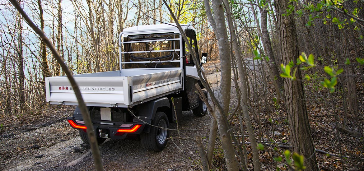 electric vehicles on a hillside dirt track